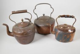 Three C19th copper kettles, largest 12" high