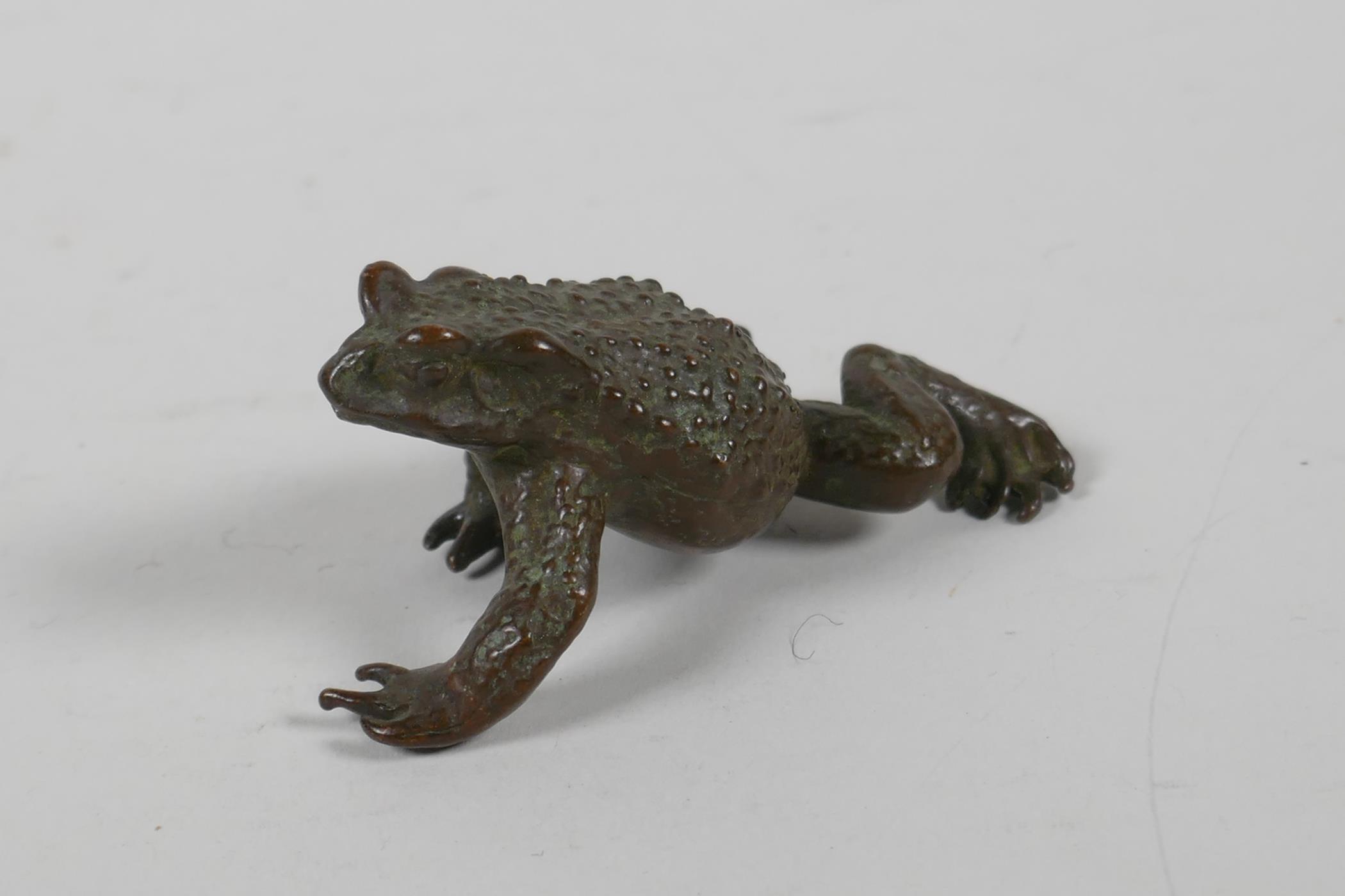 A Japanese bronze okimono in the form of a toad, indistinct impressed mark to base, 3" long - Image 2 of 3