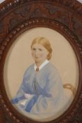 A miniature portrait of a lady, in a good oval carved oak frame. 5¾" x 5" overall