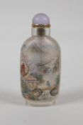 A Chinese reverse decorated glass snuff bottle depicting figures in a river landscape, and scribes