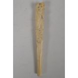 A C19th Japanese carved ivory parasol handle, carved with elephants and monkey. 7" long