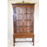 A 19th C Mahogany Chinese Chippendale style display cabinet, the upper section with two astral