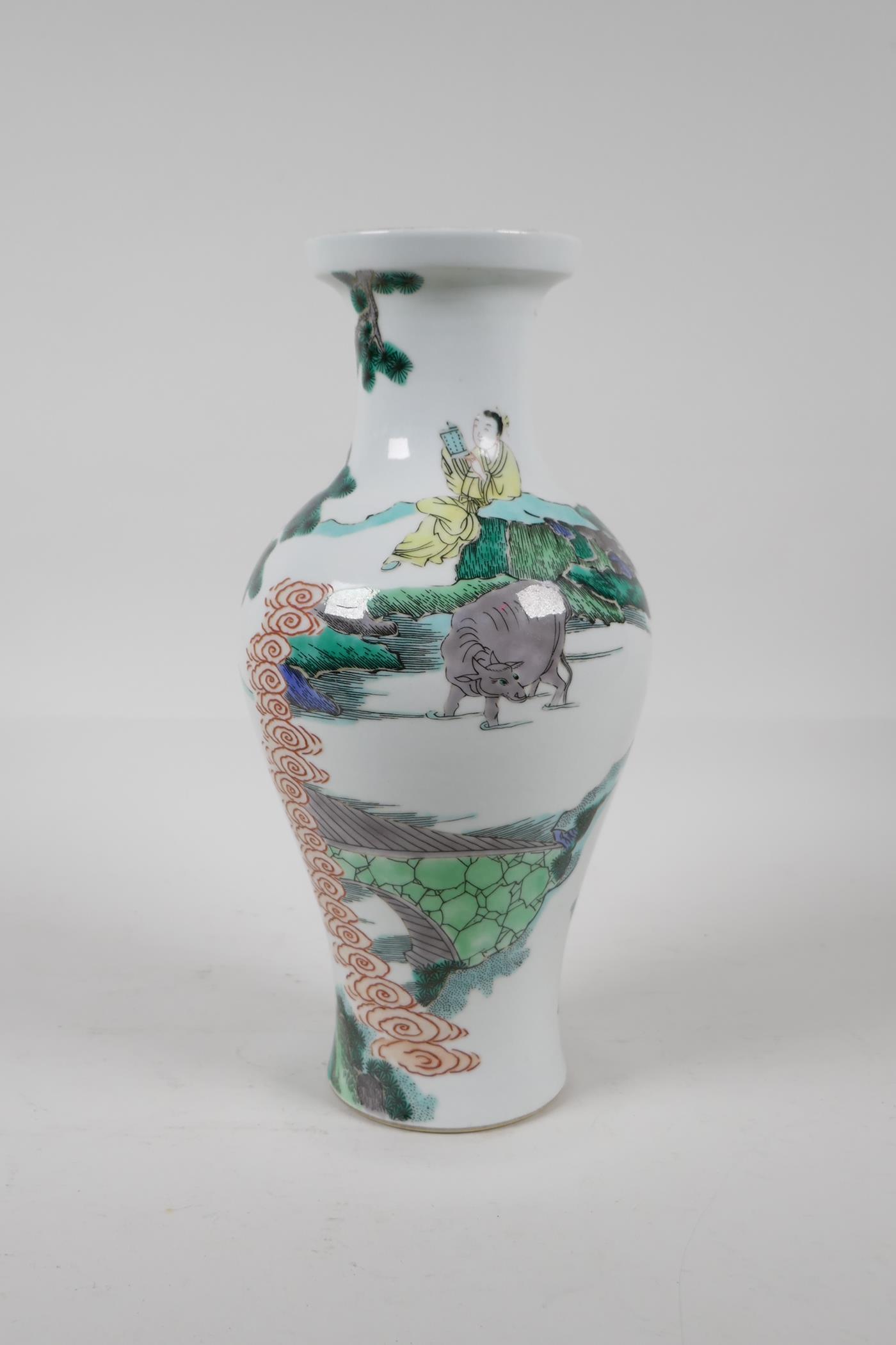 A Chinese Kangxi style famille verte porcelain vase decorated with travellers in a landscape, leaf - Image 3 of 5