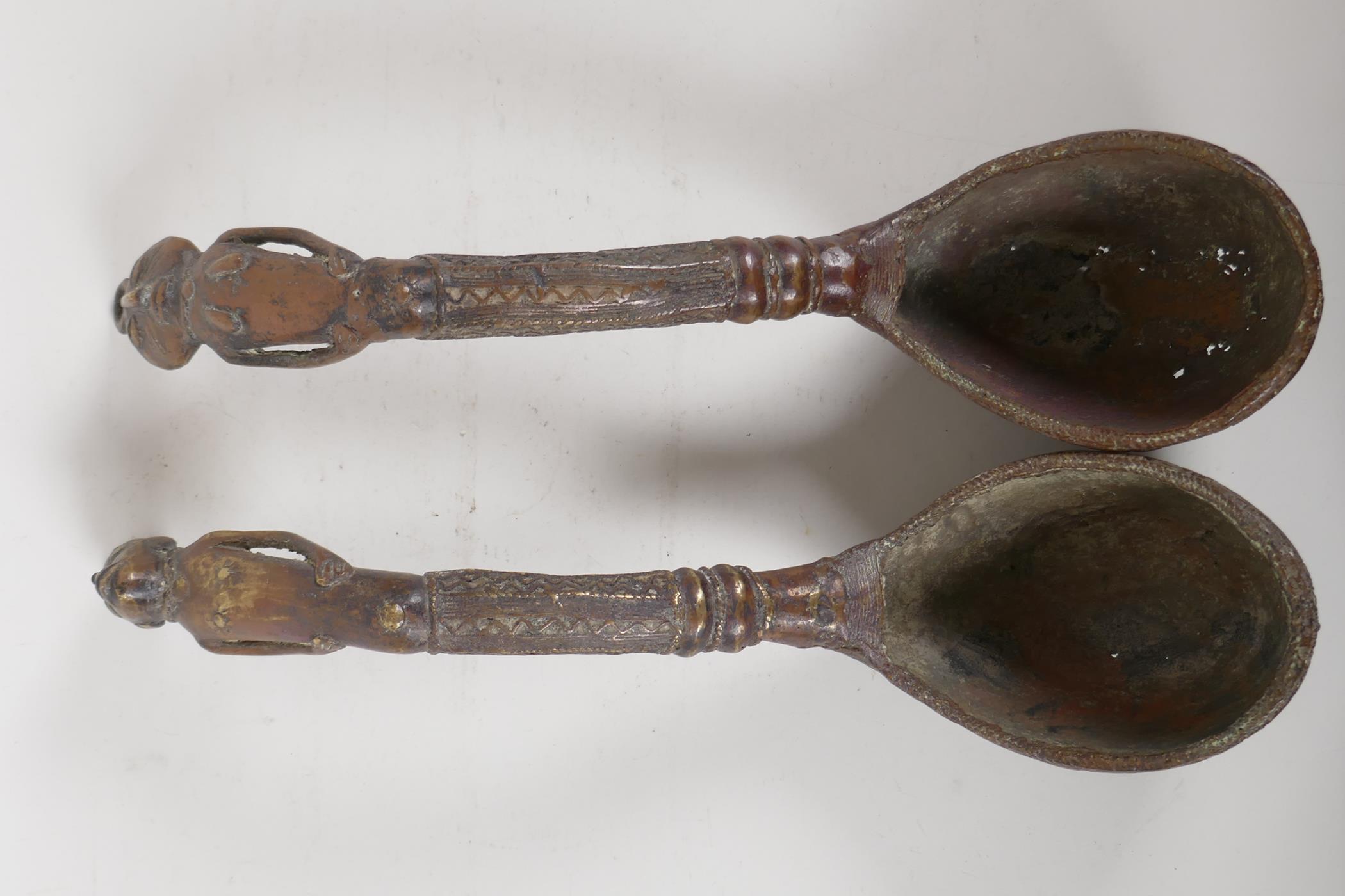 A pair of African brass ladles with figural handles. 15" long - Image 2 of 5