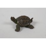 A Japanese bronze okimono in the form of a tortoise, indistinct seal mark to base, 2½" long