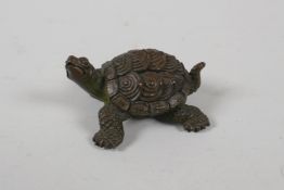 A Japanese bronze okimono in the form of a tortoise, indistinct seal mark to base, 2½" long