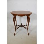A 19th C mahogany oval occasional table with satinwood banded top and shaped supports, inlaid with