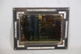 A Dutch ebonised wood mirror, with venetian glass panels. AF. 38½" x 30"