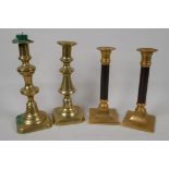 A pair of brass and wood candlesticks, 8" high and two C19th brass pusher candlesticks