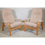 A pair of stressless style bentwood reclining armchairs. 41" high