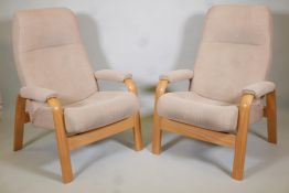 A pair of stressless style bentwood reclining armchairs. 41" high