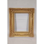 A C19th gilt and gesso picture frame, some losses, 32" x 27", A/F
