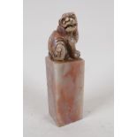 A Chinese soapstone seal, the top carved as a Fo dog, 4" high