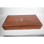 A Japanned and lacquered storage box with internal trays, signed inside the cover, 25" x 12" x 4½"