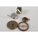 A Novelty brass cased compass, with the details of the Titanic on the cover. Together with a