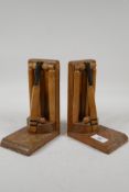 A pair of Art Deco oak bookends, in the form of a wicket, with cricket bat & ball, 8" high