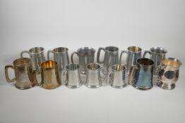 A collection of 13 silver plated & pewter tankards, largest 5" high