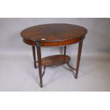 An Edwardian mahogany oval shaped centre table, with segmented flame veneered top, raised on