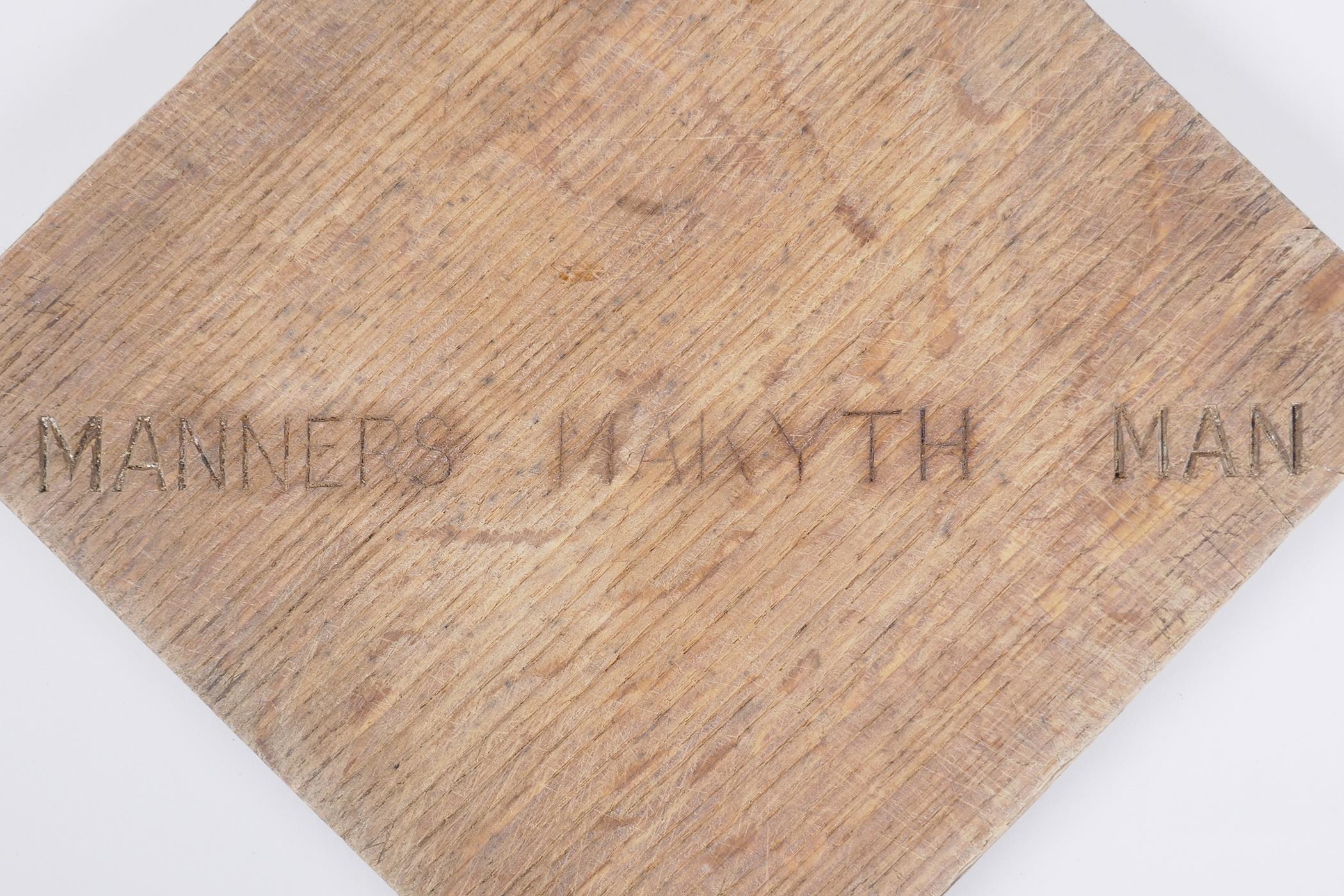 An oak panel with inset hallmarked silver cross potent and the inscription, "Manners Makyth Man". - Image 4 of 4