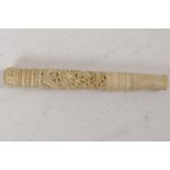 A C19th oriental carved bone parasol handle, carved with dragons. 6" long