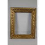 An early C19th carved giltwood picture frame. 13" x 9¾" rebate