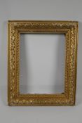 An early C19th carved giltwood picture frame. 13" x 9¾" rebate