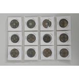 Twelve Chinese facsimile bronze coins/tokens, 1¼" diameter