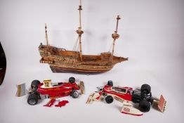 Two detailed plastic models of mid 1970s F1 racing cars, Ferrari 312 and McLaren M23, 14" long, both