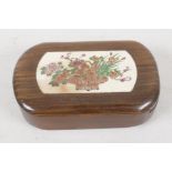 A Japanese hardwood trinket box. With a sliding lid, inset with bone panel, engraved and painted