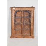 A decorative wooden wall art panel in the manner of a moorish window. 34" x 25"