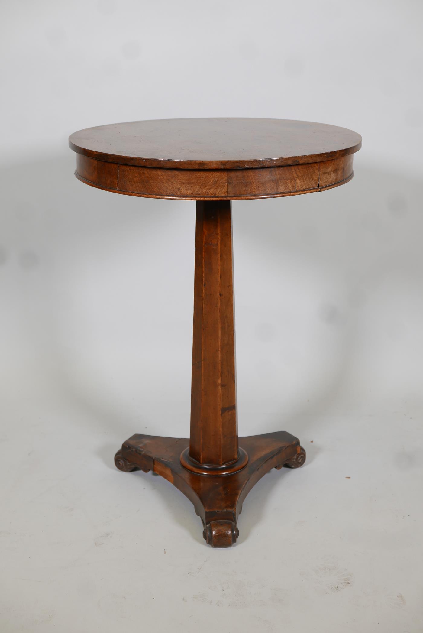 Regency mahogany occasional table with frieze top, raised on a tapering column and platform base