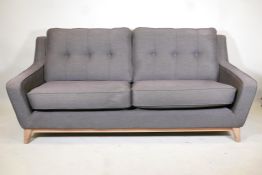 A G-Plan "Vintage" line two seater settee with buttoned back 78" long