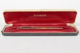 A 12k rolled gold Parker fountain pen, in a case.