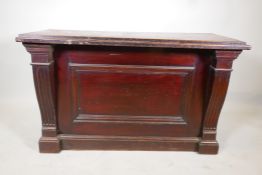 A Victorian mahogany counter, with panel front & shaped column ends. 50" x 22" x 31"