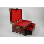 An Oriental brass bound hardwood jewellery box. With inset carved jade plaque to the lid and
