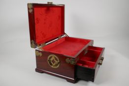 An Oriental brass bound hardwood jewellery box. With inset carved jade plaque to the lid and