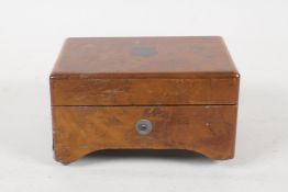 An early C20th Swiss figured walnut miniature music box, playing two airs. AF, 4½" x 3"