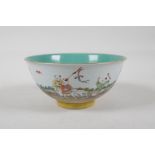 A Chinese polychrome porcelain rice bowl decorated with children playing in a garden, with a