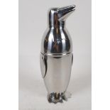 A plated novelty cocktail shaker in the form of a penguin, 9" high