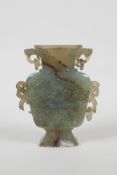 A Chinese celadon nephrite vase/flask with carved dragon decoration & handles, 4½" high, AF