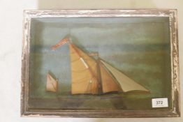 A C19th folk art ship diorama depicting a Thames barge under sail and flying a flag inscribed "