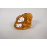 A Baltic raw amber rock, 2½" long. 68 gms