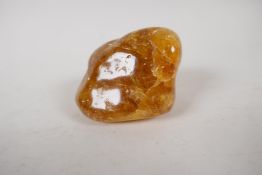 A Baltic raw amber rock, 2½" long. 68 gms