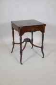 A late C19th rosewood envelope card table with floral inlay and frieze drawer, on shaped turned