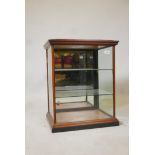 A Victorian mahogany table top display cabinet, with two glass shelves and orginal silvered mirror
