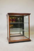 A Victorian mahogany table top display cabinet, with two glass shelves and orginal silvered mirror