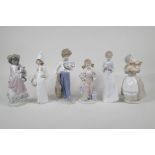 Four Lladro porcelain figures of children and two similar Nao figures, A/F, largest 9" high