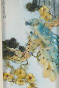 An Oriental hardstone picture of exotic birds, on a flowering branch, signed with calligraphy, 7"