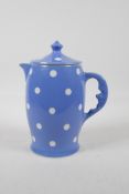 A T.G Green, Cornishware man in the moon, lidded jug. In the blue domino pattern. 8" high