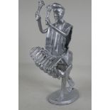 A welded metal figure of a man playing a marimba, 13" high